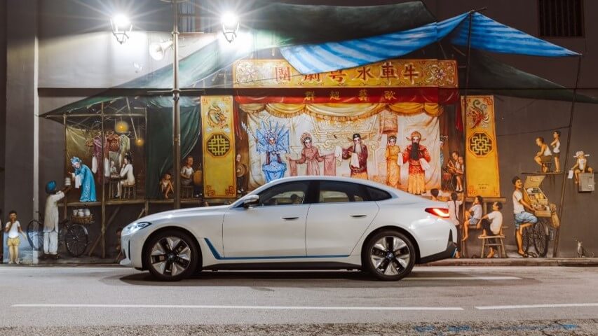 BMW i4 in front of a mural