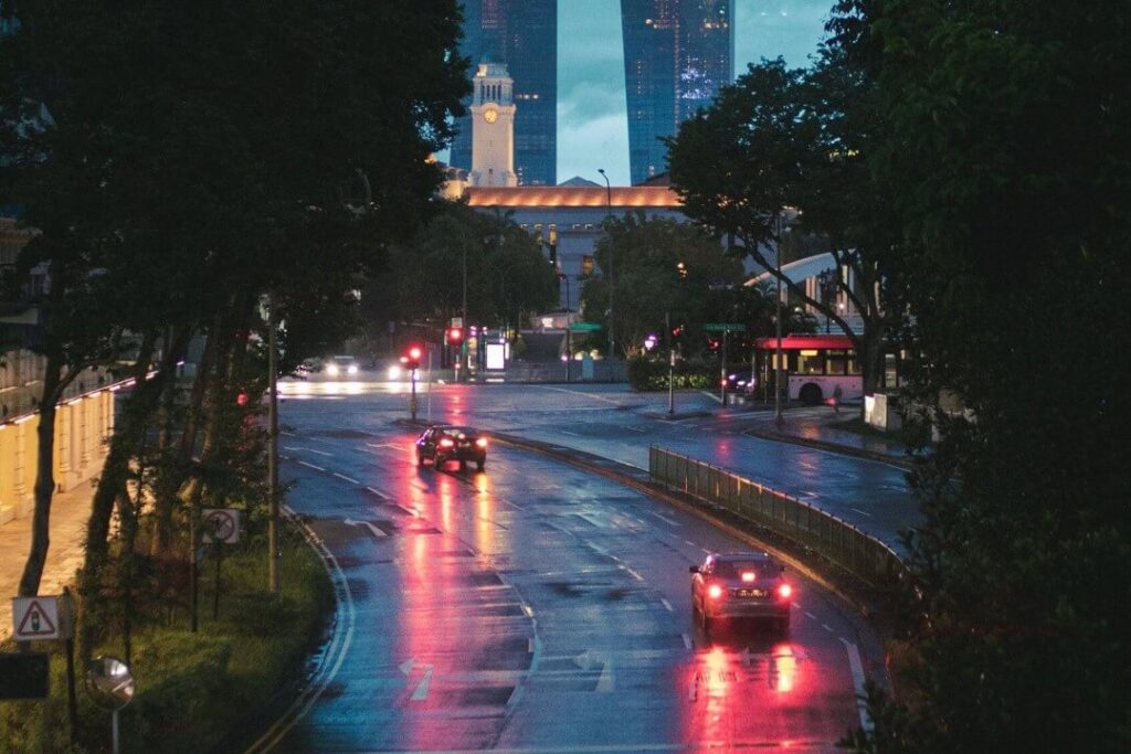 Cars on wet roads in Singapore rain